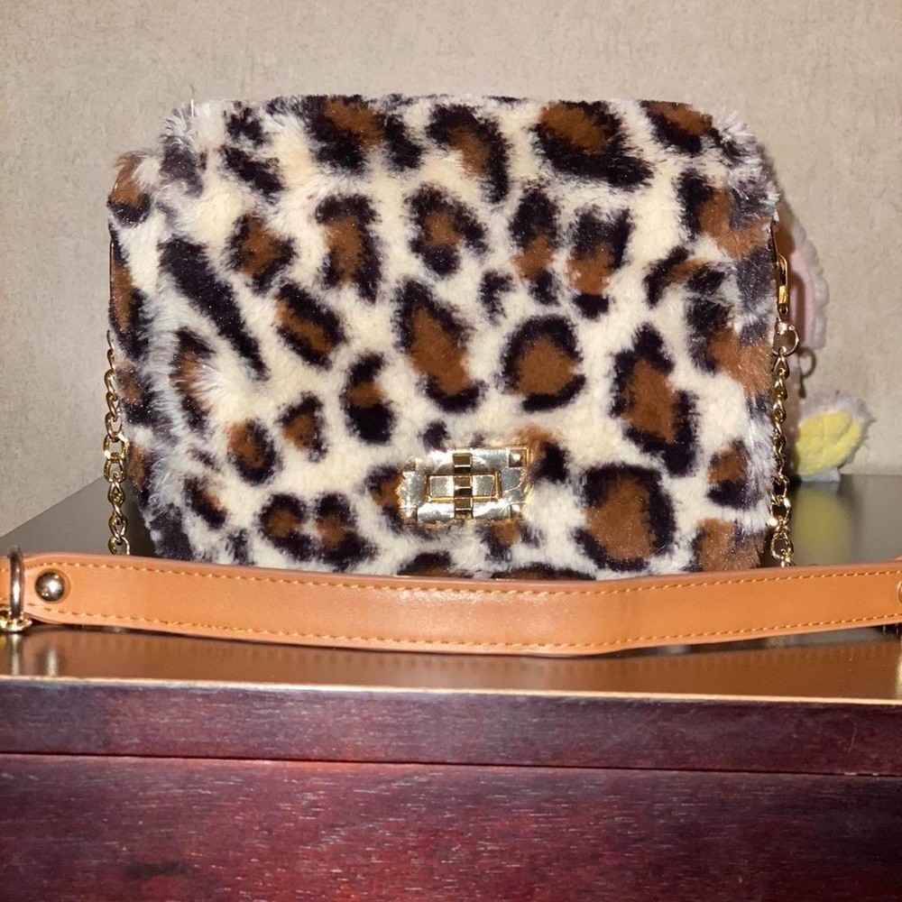 Leopard print purse, super soft and keeps shape. Bought from a boutique.